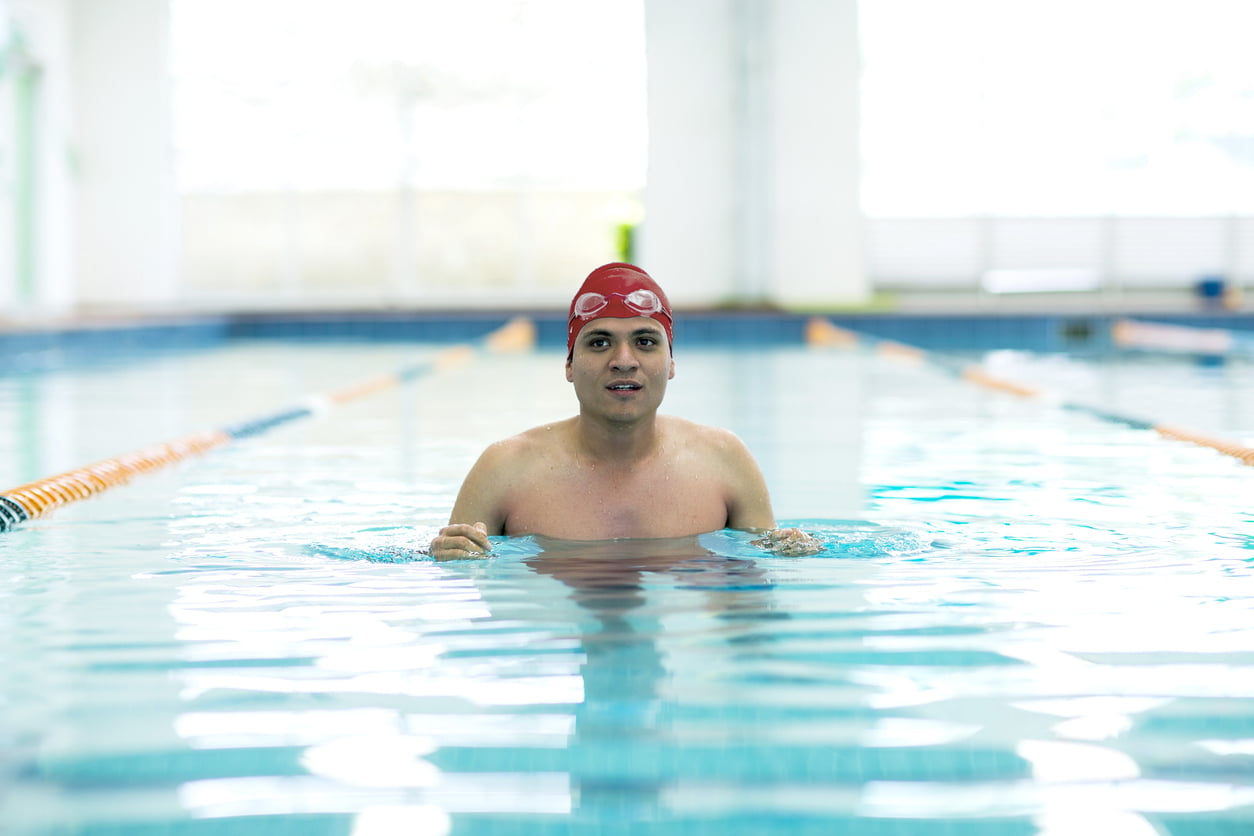 Young athletic man with butterfly swimming technique